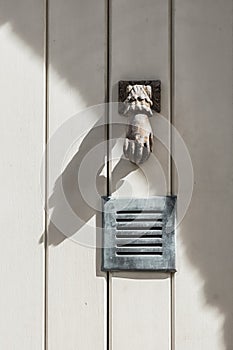 Decorative door knocker at the door of a house in Viviers in the