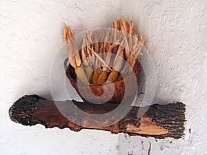 Decorative Dried Corn Cobs in Wicker Basket, Poble Espanyol, Barcelona, Spain photo