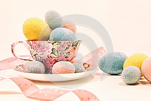 Decorative easter eggs in china cup