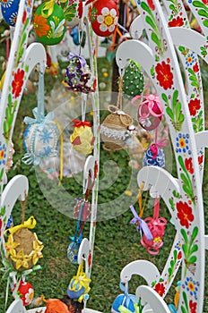 Decorative Easter eggs made of ribbons, threads and fabric at the Easter fair