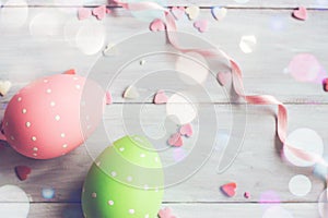 Decorative easter eggs on white wooden background photo