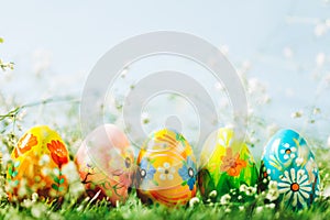 Decorative eggs on green grass