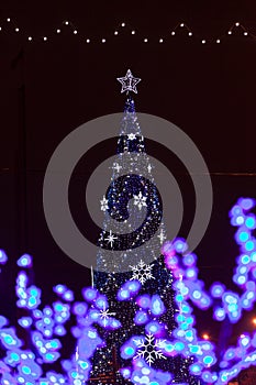 Decorative electrics tree bulbs flowers on New Year Eve