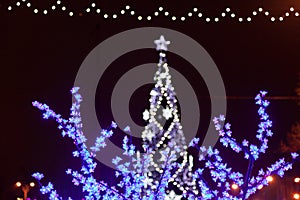 Decorative electrics tree bulbs flowers on New Year Eve