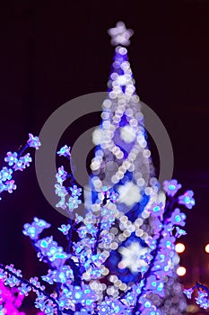 Decorative electrics tree bulbs flowers on New Year Eve