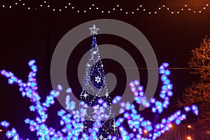 Decorative electrics tree bulbs flowers on New Year Eve