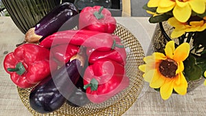 decorative elements red peppers, eggplant and yellow flowers