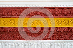 Decorative embossed border on the exterior of the building wall.