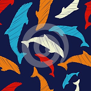 Decorative embroidered dolphins swim in the sea and ocean. Seamless pattern. Marine life. Cute cartoons.