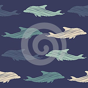 Decorative embroidered dolphins swim in the sea and ocean. Seamless pattern. Marine life. Cute cartoons.