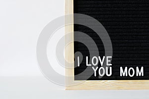 Decorative felt board with the inscription I Love You Mom. Mother love concept. Concept for congratulations on Mother`s Day. Ð¡op