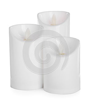 Decorative flameless LED candles on white background