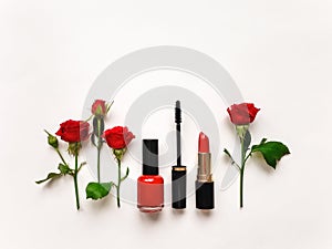 Decorative flat lay composition with cosmetics and flowers. Flat lay, top view