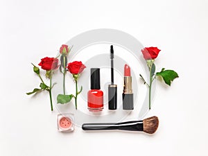 Decorative flat lay composition with cosmetics and flowers. Flat lay, top view