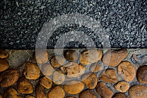 Decorative floor pattern of sand and small gravel stones, texture abstract background