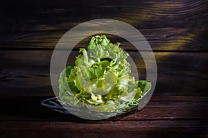 Decorative flower cabbage on a wooden background.