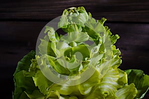 Decorative flower cabbage on a wooden background.