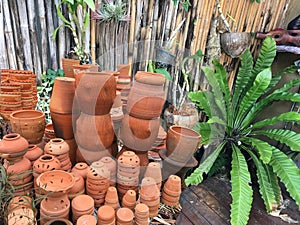Decorative flower pots and vases stacking at garden shop.
