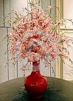 Decorative flowers in an elegant vase can beautify a room