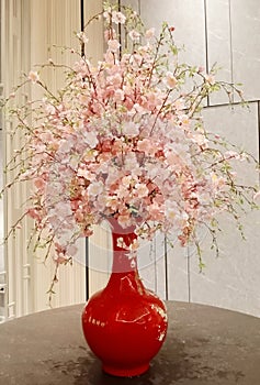 Decorative flowers in an elegant vase can beautify a room