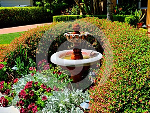 Decorative fountain in front of a luxury home