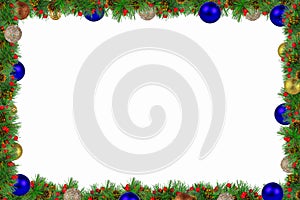 Decorative frame of spruce branches and colorful New Year`s decoration around the edges