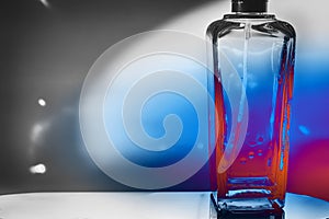 Decorative glass bottle with spray with colored highlights and shadows