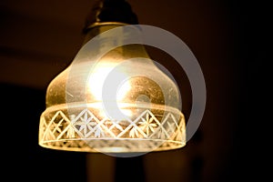 Decorative glass old lamp in a dark room