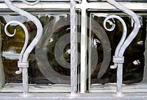 Decorative grille in front of glass block window