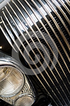 Decorative grille and headlights of vintage retro car