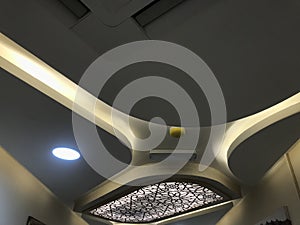 A Decorative Gypsum board suspended false ceiling with Coves for indirect lighting for an big hall area of an specialty hospital