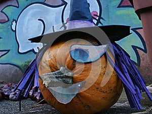 Decorative halloween full jack-o-lantern pumpkin styliyzed as one eyed witch