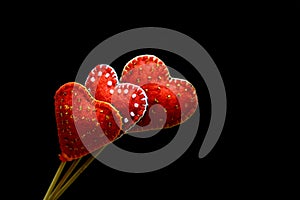 Decorative hand made hearts on black background