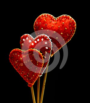 Decorative hand made hearts on black background