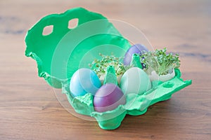 Decorative handmade easter egg present box with eggs and cress