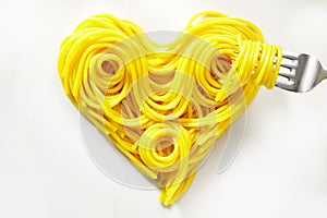 Decorative heart of coiled cooked spaghetti