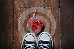 Decorative heart on wooden floor