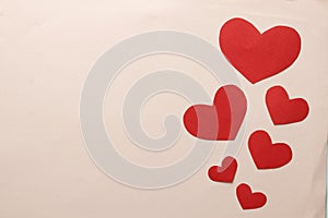 Decorative hearts close-up on a colored background. Valentine`s day decor concept.