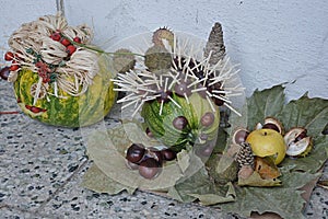 Decorative hedgehog made of pumpkin, chestnusts and matches