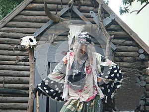 Decorative hut of logs and Baba Yaga