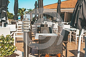 Decorative lanterns along the street cafe barrier. Front of street cafe. Modern european cafe