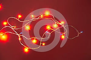 Decorative LED bulbs with a variety of colors and flashes on a red background