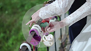 The decorative lock in hands of newlyweds. Clip. Wedding symbol of everlasting love, lock in hands of bride and groom