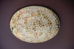 A decorative luminaire fixture installed on a ceiling.