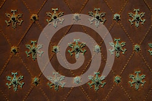 Metal ancient background with green iron decorative figures