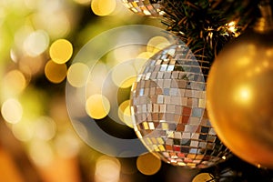 Decorative with mirror ball or Christmas ball for merry Christmas and happy new years festival with bokeh background.