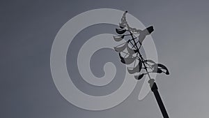 Decorative modern spinning weather vane in the backyard