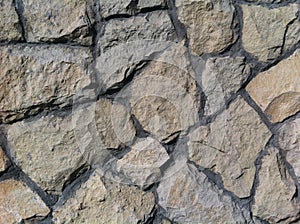 Decorative natural stone. Natural decoration of the facade of the house, building