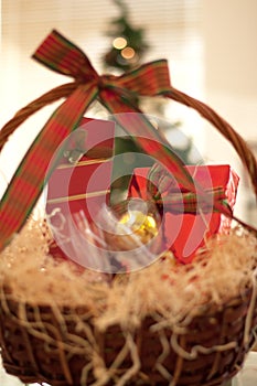 Decorative New Year`s gift baskets with a set of sweets and alco