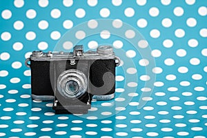 Decorative Old Antique Camera on Blue Background